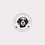 Black and white logo featuring an Australian Shepherd dog, showcasing its distinctive features and playful spirit.