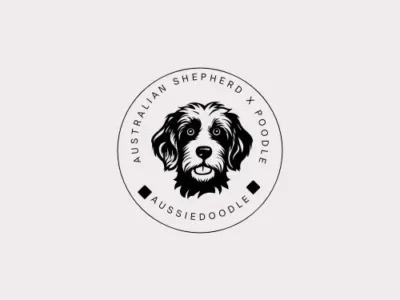 Black and white logo featuring an Australian Shepherd dog, showcasing its distinctive features and playful spirit.